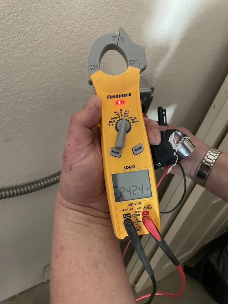 Voltage testing with clamp meter during Electrical Installation Services in Del Monte Forest